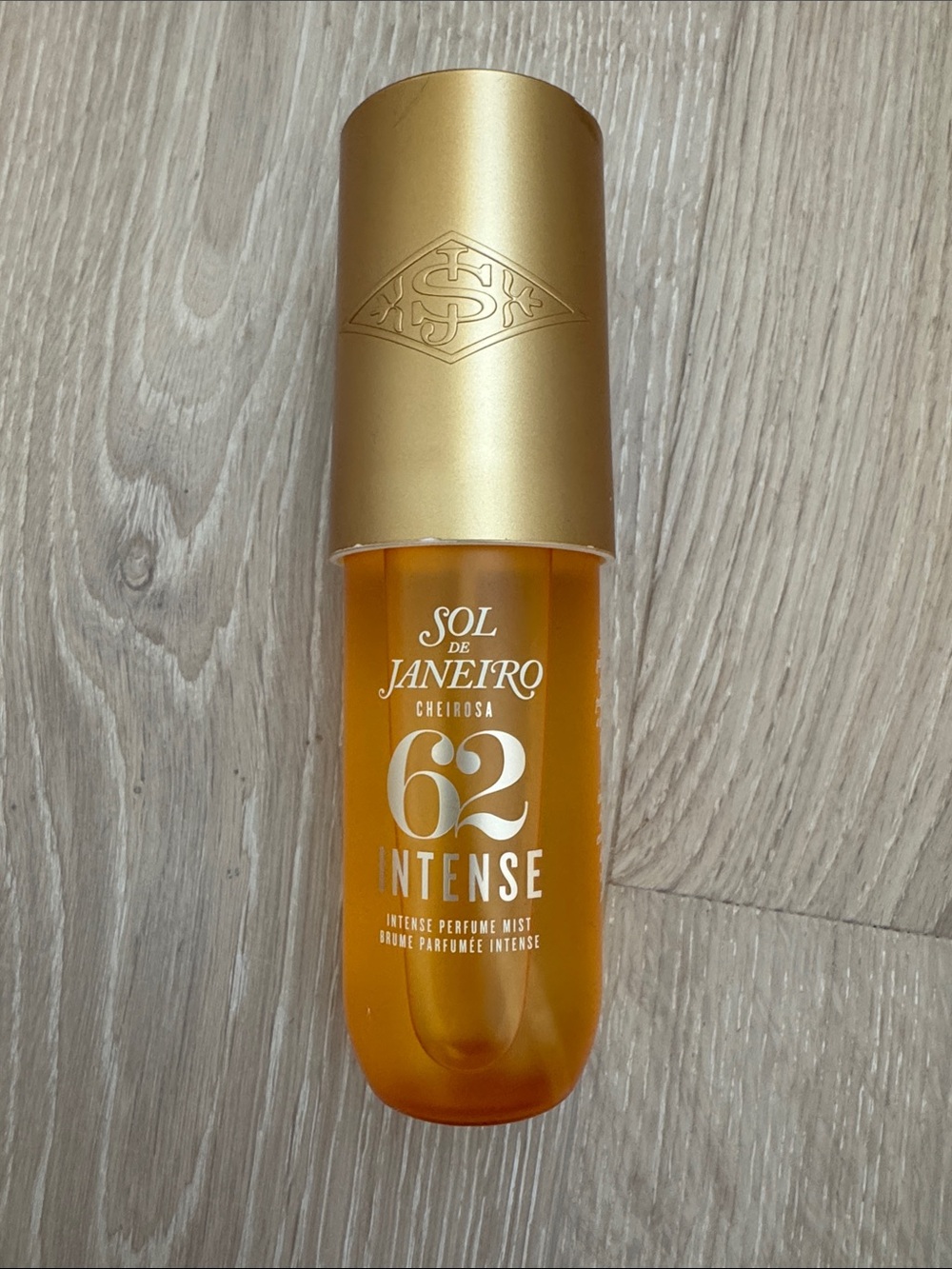 Sol de Janeiro 62 Intense Perfume Mist — Gold and Orange Bottle